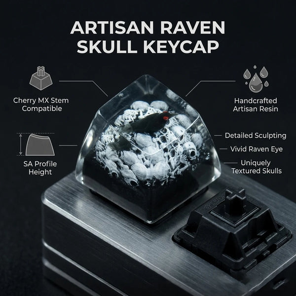 An artisan raven skull keycap made of resin displayed on a metal surface.