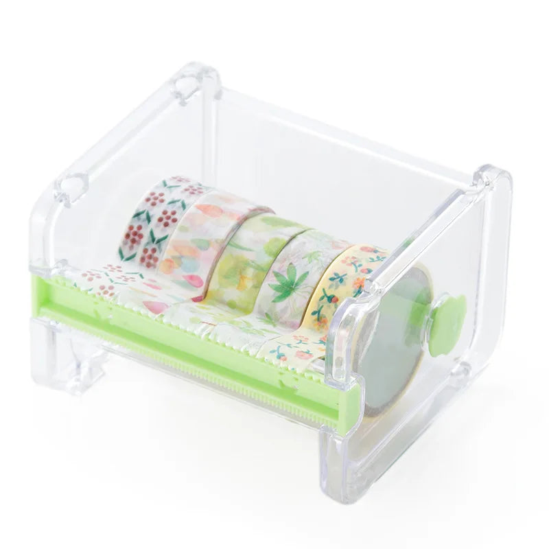 Dispenser de plástico transparente para cinta washi de varios estilos, con cintas estampadas en colores pastel.