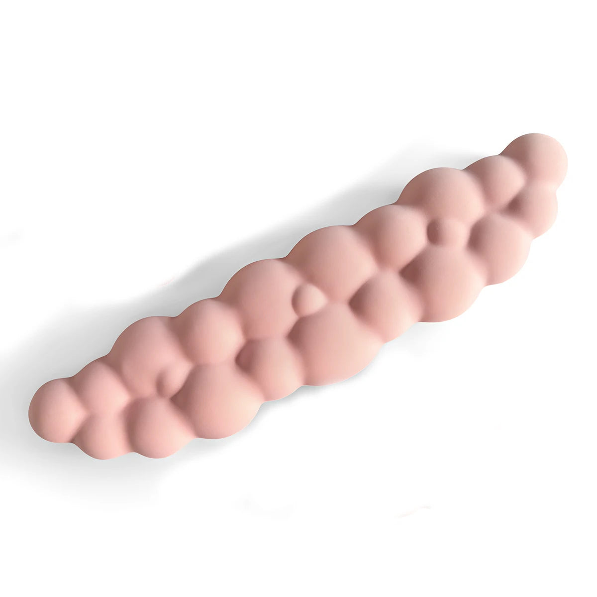 A pink ergonomic memory foam wrist rest pad for desk and mouse, shown in profile.