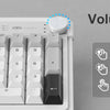 A close-up view of a white membrane keyboard showing the volume knob and various keys.