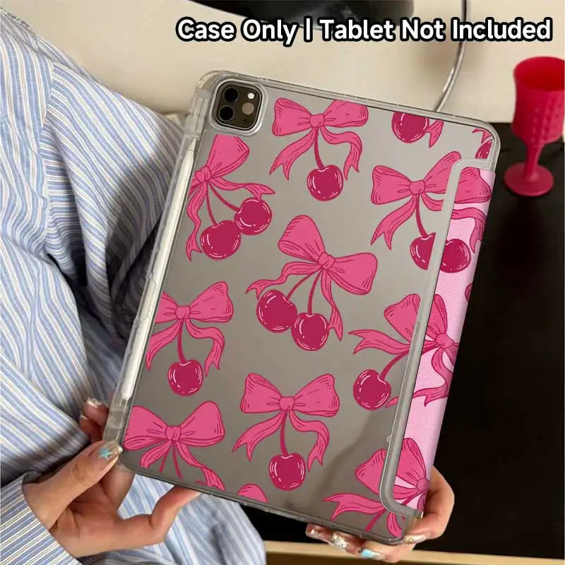 A pink cherry patterned protective cover for an iPad is shown being held by a person.