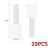 White reusable adhesive cable ties with a cylindrical body and square head for desk organization