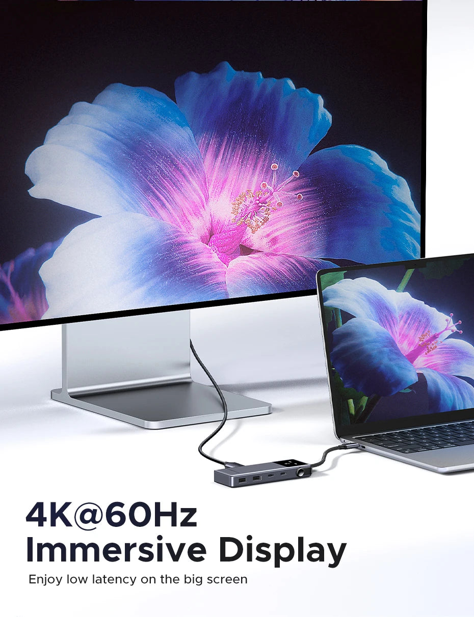 A laptop connected to a monitor displaying a vibrant blue and purple flower, demonstrating a 4K@60Hz immersive display.