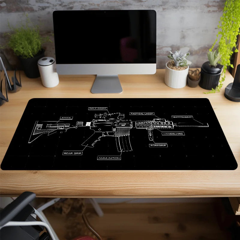 A black gaming mouse pad featuring a white line drawing of various firearms and weaponry on a wooden desk.