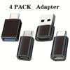 A set of four black adapters for converting USB-C to various other ports like USB-A and Micro USB.
