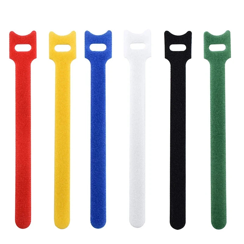 A set of reusable nylon cable organizer ties in red, yellow, blue, white, black, and green.