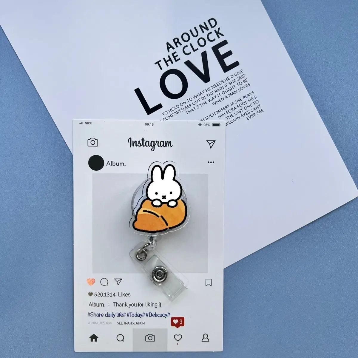 A clear badge reel with a Miffy rabbit charm attached, displayed on a white Instagram post.