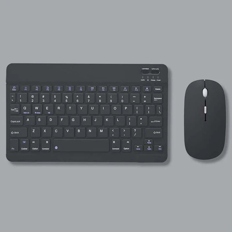A dark gray multi-device Bluetooth keyboard and mouse combo shown on a flat surface.