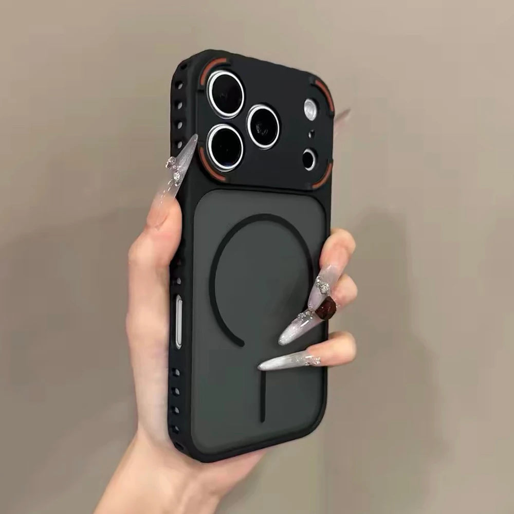 A hand holds a black frosted magnetic silicone case for an iPhone, displaying the back panel and camera module.