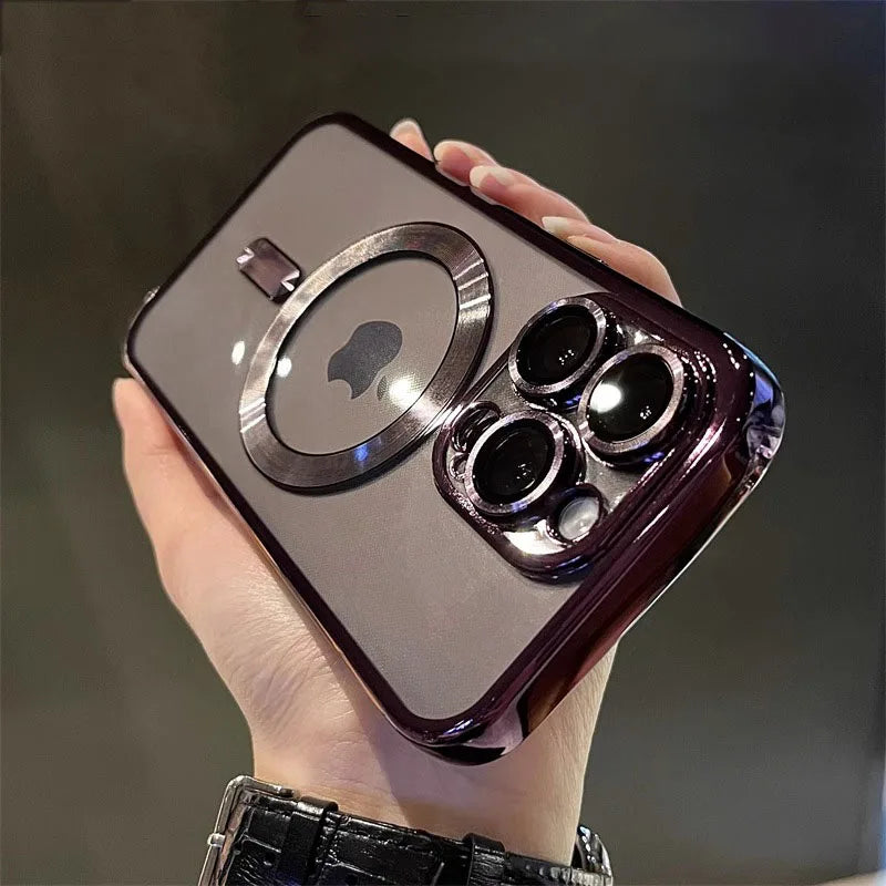 A hand holds a dark purple magnetic clear case with a plated finish for a MagSafe iPhone.