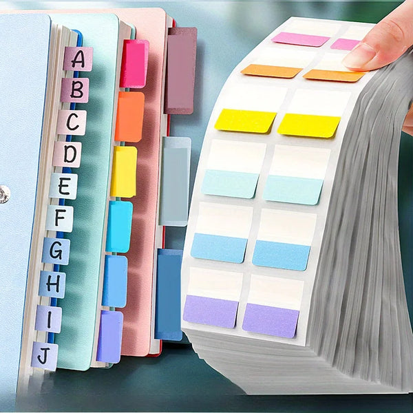 A hand is sorting colorful index tags in a stack of paper for organization.
