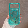 A hand holds a clear teal silicone shockproof magnetic case with a glitter finish for an iPhone.