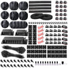 A collection of black cable organizers, including cable ties, clips, and wraps for managing desk cables.