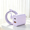 A purple dual-port USB-C fast charging cable with a rectangular adapter plugged into a white surface.