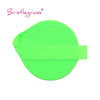 A bright lime green elastic hair tie or trim, flat and cylindrical.