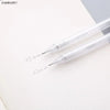 A set of two clear mechanical pencils, one 0.5mm and one 0.7mm, resting on a white surface.