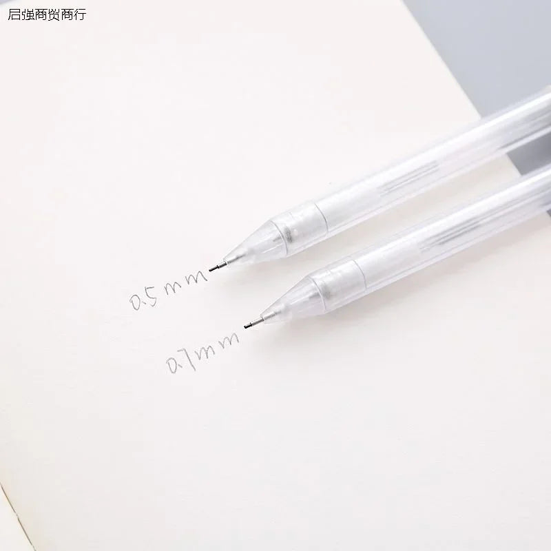 A set of two clear mechanical pencils, one 0.5mm and one 0.7mm, resting on a white surface.