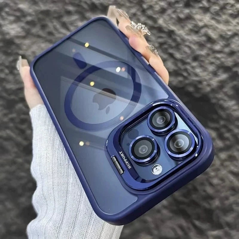 A hand holds a dark blue MagSafe-compatible phone case featuring a built-in camera bracket and lens cover.