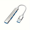 A silver USB 2.0 hub with four ports and an OTG adapter cable.
