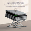 A stack of silver aluminum laptop stands folded and stored on a surface.