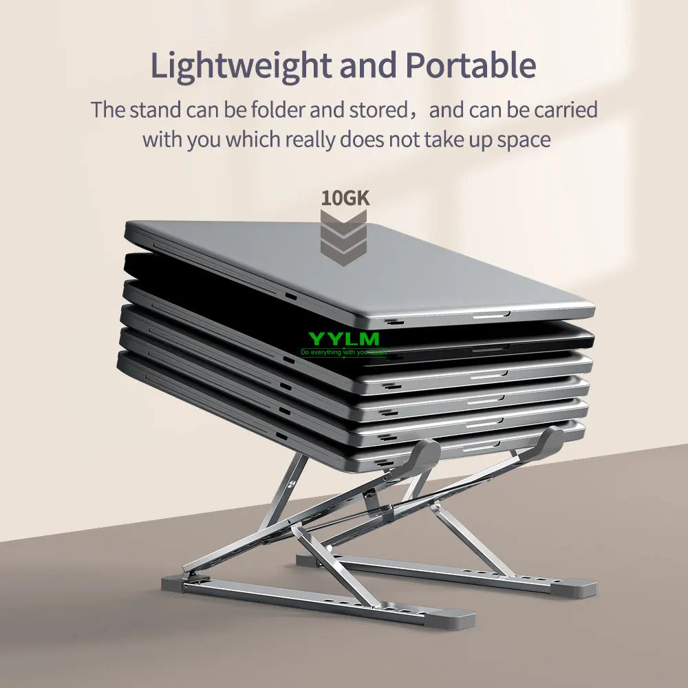 A stack of silver aluminum laptop stands folded and stored on a surface.