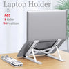 A silver foldable adjustable laptop holder with multiple positions is shown on a wooden desk.