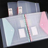 A set of clear plastic expandable binder pockets for ring binders in various shades of pink and blue.