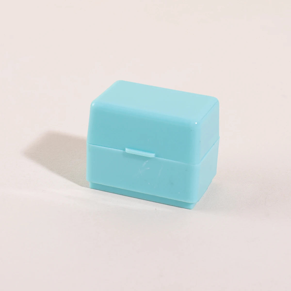 A light blue privacy protection roller stamp is shown on a white background.