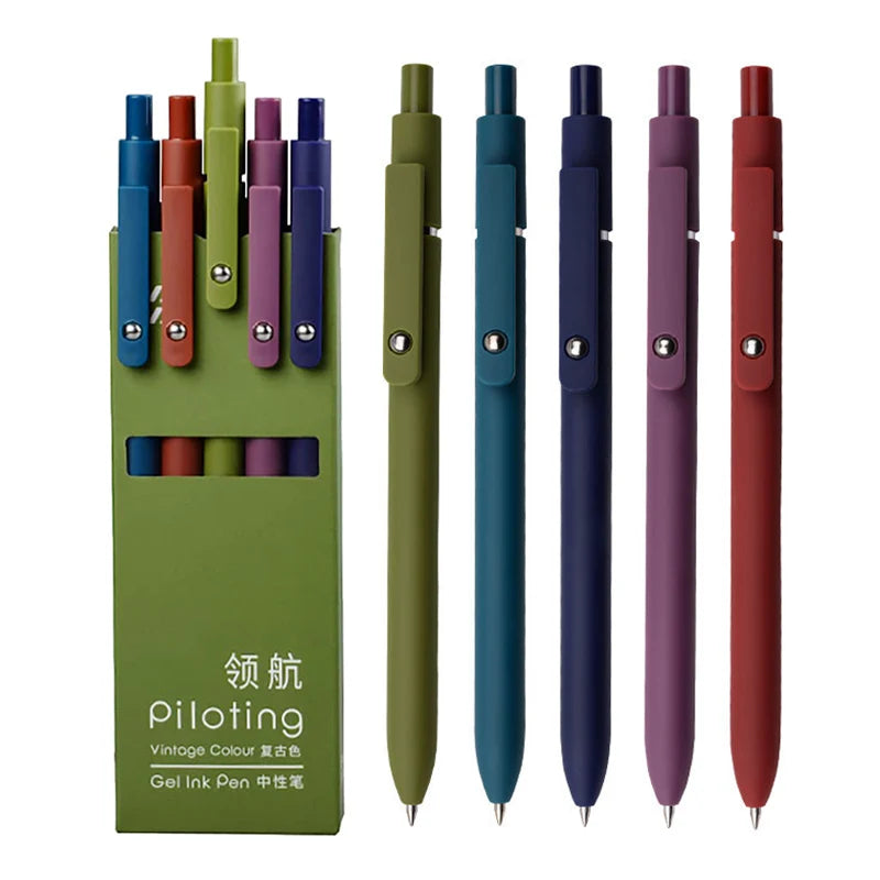 A set of five green and purple gel ink pens with soft grips displayed against a white background.