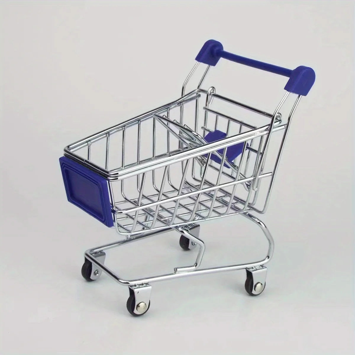 A silver mini shopping cart desktop organizer with blue handles and rolling wheels.