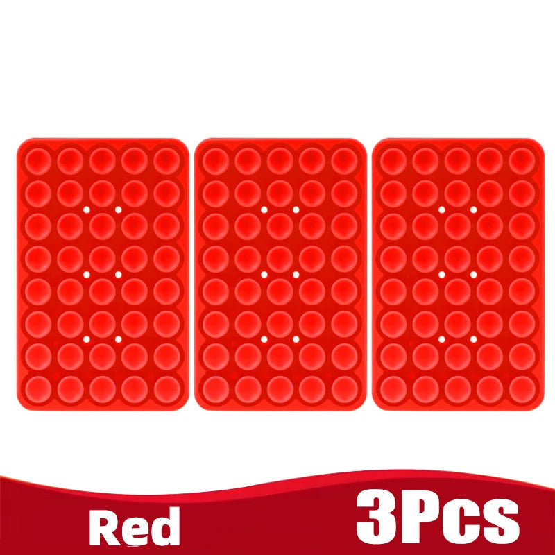 Three red silicone suction cup phone holders arranged side by side.