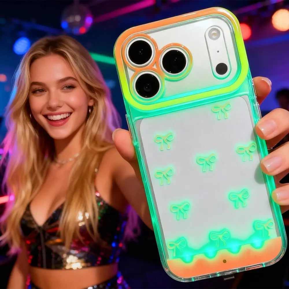 A hand holds a clear phone case with an LED bowknot glow feature, displaying a light show on the back.