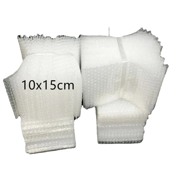 A pair of white clear plastic bubble mailer shipping bags, measuring 10x15 cm.