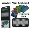 A set of colorful mini keyboards and a full-size mechanical keyboard are displayed with their packaging.