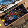 A black mouse pad featuring various cartoon characters and gaming elements.
