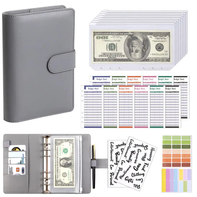 A grey A6 PU leather budget binder with cash envelopes and a sheet of US hundred dollar bills.