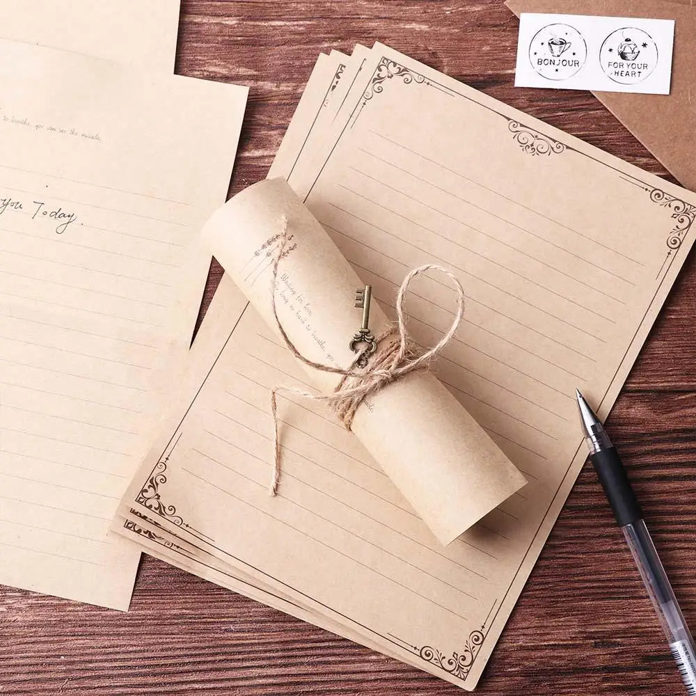 A set of vintage European style letter and invitation envelopes on brown paper with a rolled parchment inside.