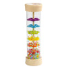 A wooden rain sound tube musical instrument with colorful plastic beads inside.