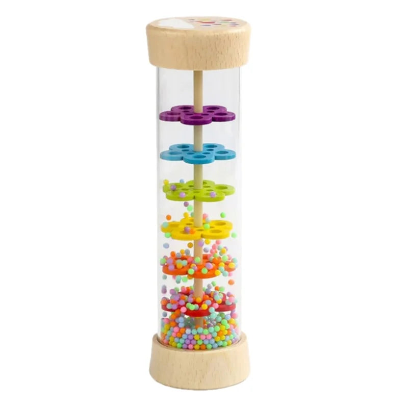 A wooden rain sound tube musical instrument with colorful plastic beads inside.