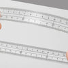 A set of transparent measuring tools showing various scales and markings for precise measurement.