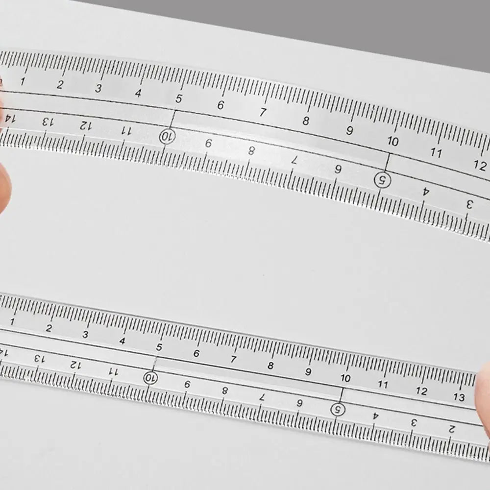 A set of transparent measuring tools showing various scales and markings for precise measurement.