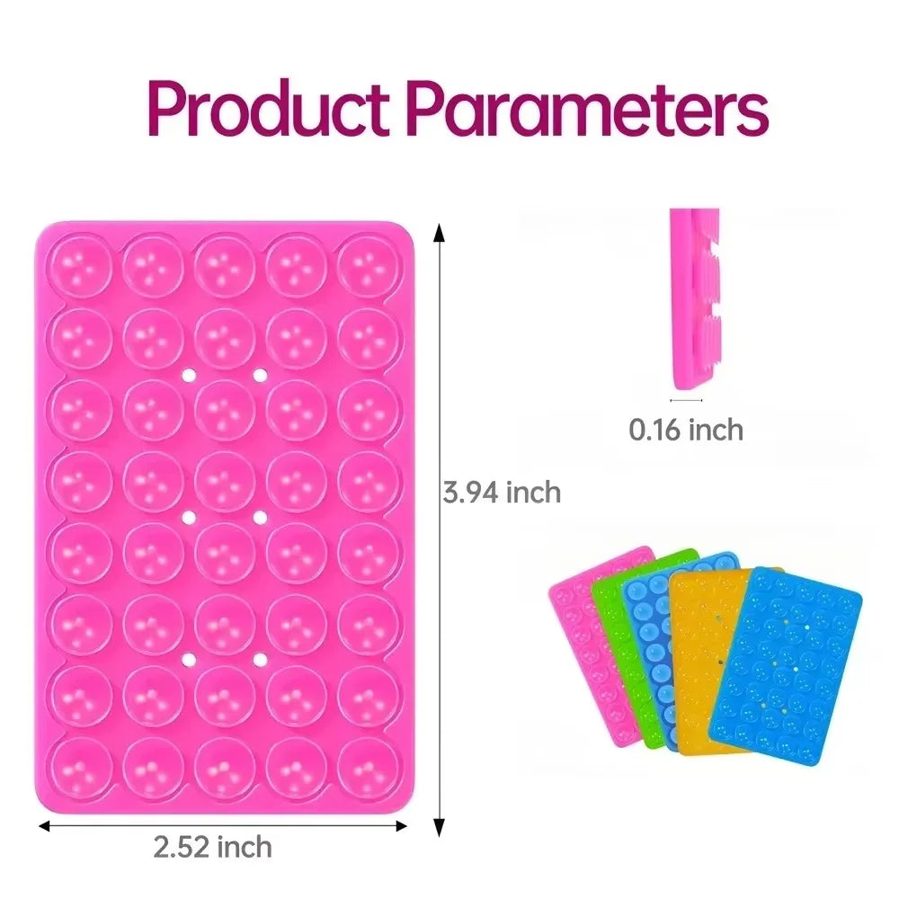 A pink double-sided silicone phone mount grip with multiple colored grips.