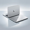 Silver MacBook Pro laptop with a reflective surface and shadow.