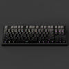 A black mechanical keyboard with gradient gray double shot PBT keycaps and side printing shown from the top.