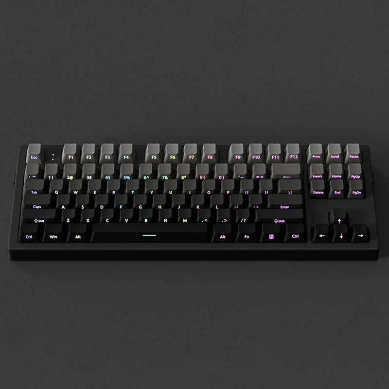 A black mechanical keyboard with gradient gray double shot PBT keycaps and side printing shown from the top.
