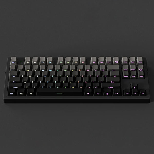 A black mechanical keyboard with gradient gray double shot PBT keycaps and side printing shown from the top.
