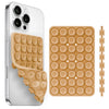 A silver smartphone is shown next to a beige silicone suction cup phone holder and a separate wooden stick.