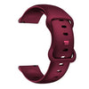 A close-up view of a deep magenta silicone watchband for an Amazfit Bip 6.