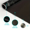 A roll of black fabric mouse pad with a silver edge and circular icons highlighting its smooth fabric, non-slip rubber base, 