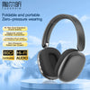 A pair of black foldable and portable zero-pressure wearing headphones displayed on a light blue surface.